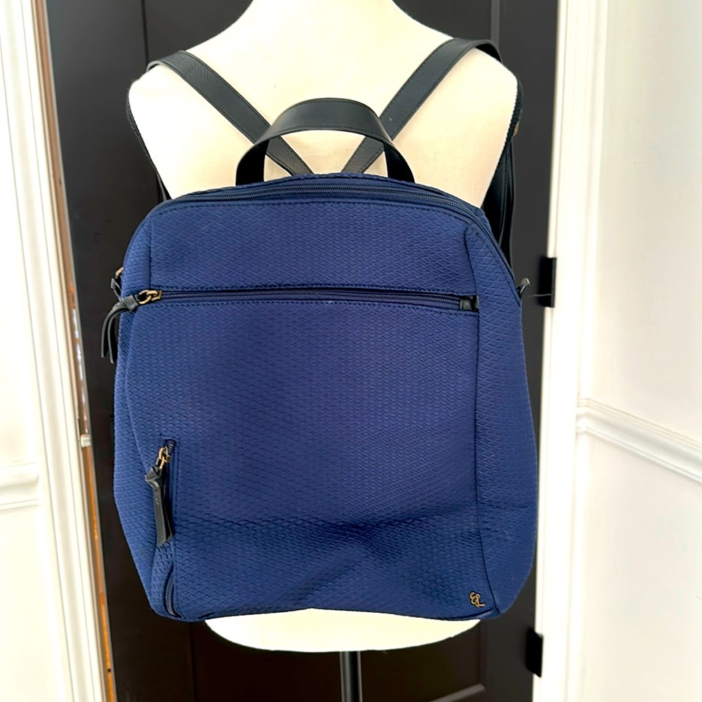 Navy blue diamond pattern, small backpack, barely used excellent condition